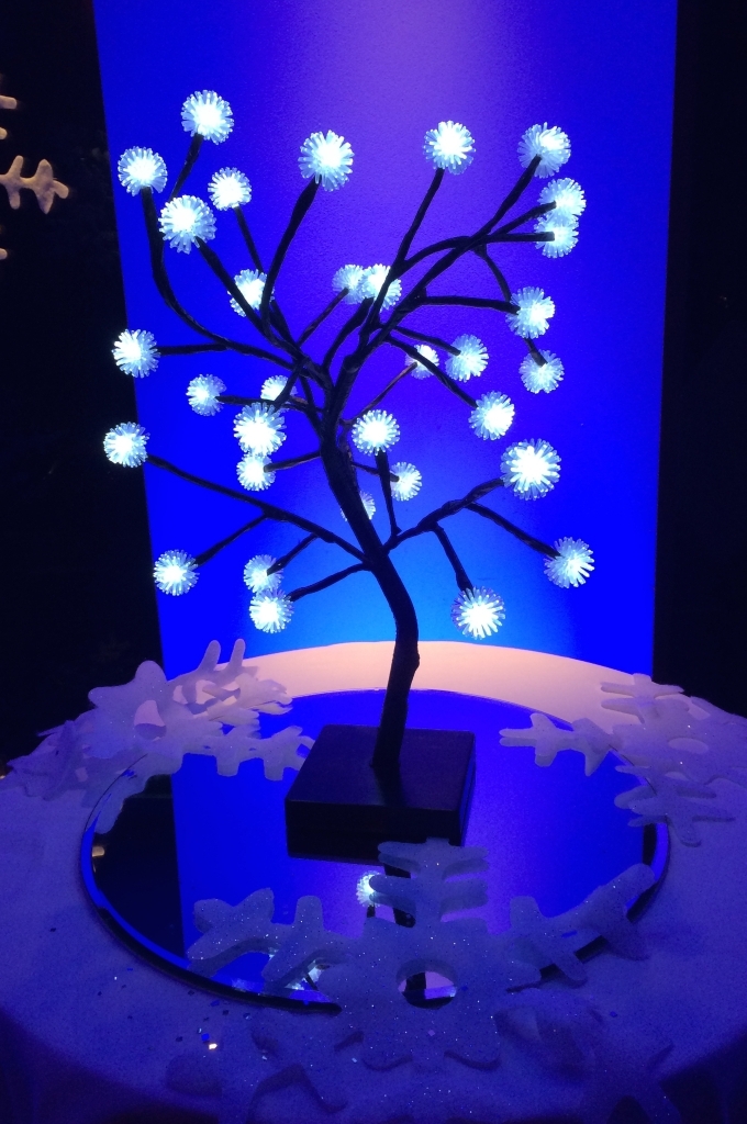 Fibre optics tree lamp lighting effect standing on a table as used in corporate event production.