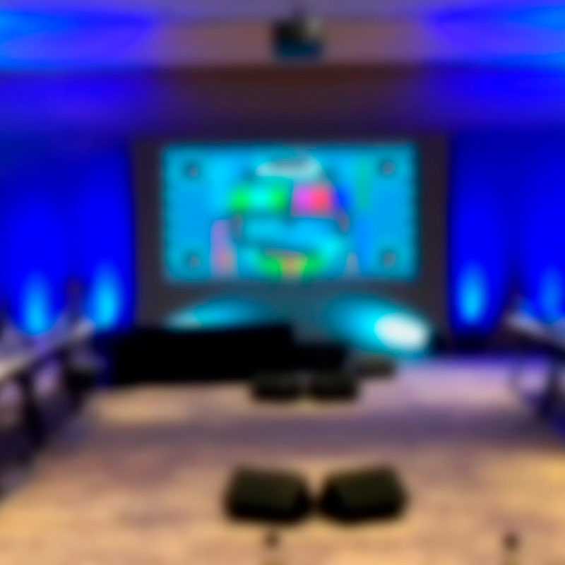Blurred image of audio visual equipment as used in corporate event production.